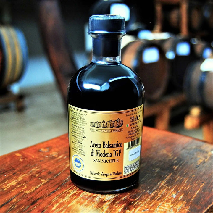 Bottles of Aceto Balsamico di Modena IGP San Michele in 250ml and 500ml sizes with quality certification logo